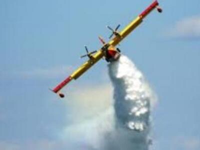 Πάτρα: Canadair πάνω από τις στέγες των ...
