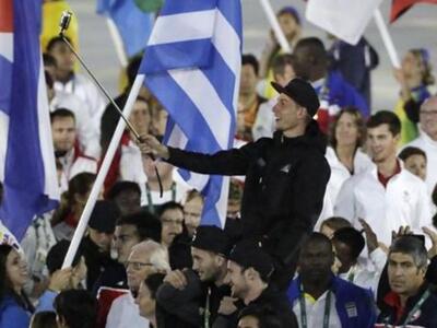 An athlete takes a selfie during the clo...